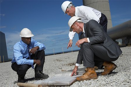 factory, african american - Businessmen Looking at Blueprint Outside of Factory Stock Photo - Premium Royalty-Free, Code: 600-01582098