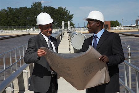 simsearch:600-01582045,k - Businessmen Looking at Blueprint Outside Water Treatment Plant Stock Photo - Premium Royalty-Free, Code: 600-01582112