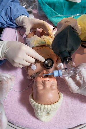 drilling (method used for training) - Nurses Practicing on Baby Mannequin Stock Photo - Premium Royalty-Free, Code: 600-01595849