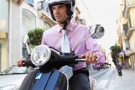 simsearch:700-00365663,k - Businessman Riding Moped Photographie de stock - Premium Libres de Droits, Code: 600-01593632