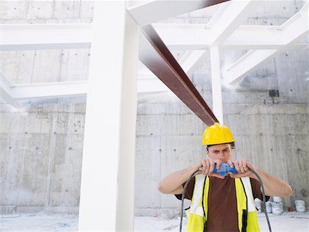 power outlet - Construction Worker With Electrical Cord Foto de stock - Sin royalties Premium, Código: 600-01593907