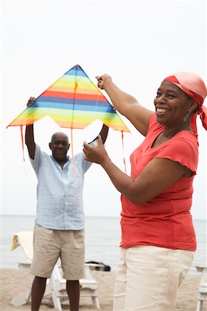 people flying kites in the sky - Couple Flying Kite Stock Photo - Premium Royalty-Free, Code: 600-01605931