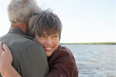 senior emotion - Couple Hugging by Water Stock Photo - Premium Royalty-Free, Code: 600-01606146