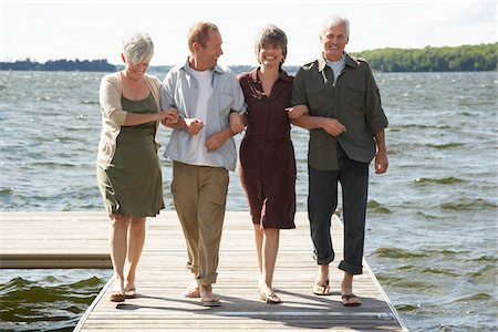 simsearch:600-01606144,k - Couples Walking on Dock Stock Photo - Premium Royalty-Free, Code: 600-01606140