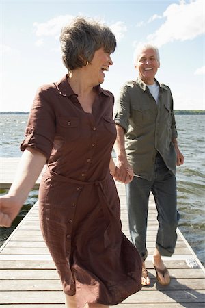 summer activity adults - Couple Walking on Dock Stock Photo - Premium Royalty-Free, Code: 600-01606143