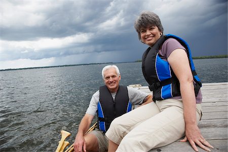 Couple on Dock with Canoe Stock Photo - Premium Royalty-Free, Code: 600-01606207