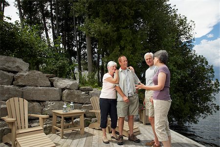 senior women chat - Couples on Deck by Lake Stock Photo - Premium Royalty-Free, Code: 600-01606202