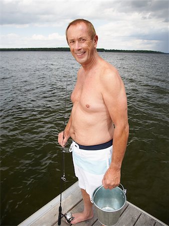 senior man happy portrait - Man on Dock with Fishing Gear Stock Photo - Premium Royalty-Free, Code: 600-01606210