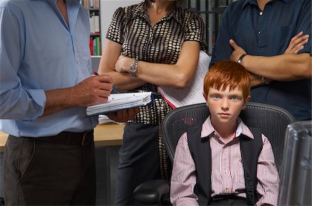 portrait of young businesswoman sitting - Boy Working in Office Stock Photo - Premium Royalty-Free, Code: 600-01606426