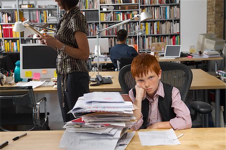 portrait of young businesswoman sitting - Boy Working in Office Stock Photo - Premium Royalty-Free, Code: 600-01606429