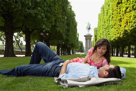 Couple Lying Down at Park Stock Photo - Premium Royalty-Free, Code: 600-01606542