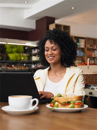 simsearch:700-00592868,k - Woman Using Laptop in Cafe Fotografie stock - Premium Royalty-Free, Codice: 600-01606689