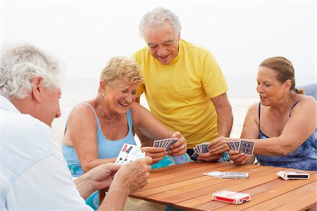 senior citizens swimsuit - Friends Playing Cards Stock Photo - Premium Royalty-Free, Code: 600-01606819