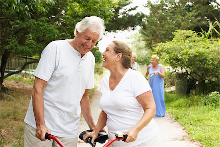 senior friends laughing - People With Bicycles Stock Photo - Premium Royalty-Free, Code: 600-01606813