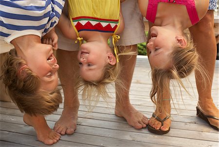 flip flops kid - Parents Holding Children Upside Down Stock Photo - Premium Royalty-Free, Code: 600-01614170