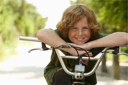 red haired preteen boys - Boy Riding Bicycle Stock Photo - Premium Royalty-Free, Code: 600-01614203