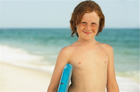 eye contact red hair freckles - Boy on Beach Stock Photo - Premium Royalty-Free, Code: 600-01614214