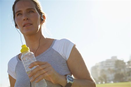 sports park - Woman Holding Water Bottle Stock Photo - Premium Royalty-Free, Code: 600-01614564