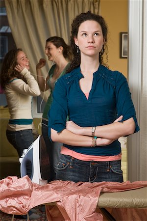 friends home upset - Teenaged Girl Doing Housework While Friends Party Stock Photo - Premium Royalty-Free, Code: 600-01614602