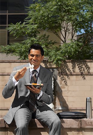 simsearch:600-01614665,k - Businessman Eating Lunch Foto de stock - Royalty Free Premium, Número: 600-01614679