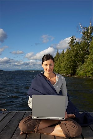 secluded lake woman - Woman Using Laptop on Dock Stock Photo - Premium Royalty-Free, Code: 600-01614825