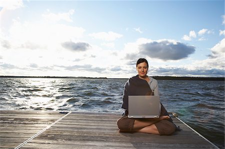 Woman Using Laptop on Dock Stockbilder - Premium RF Lizenzfrei, Bildnummer: 600-01614826