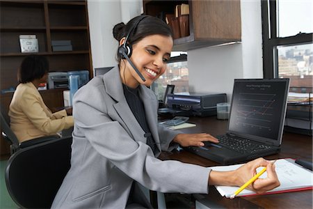 Portrait of businesswoman using laptop Stock Photo - Premium Royalty-Free, Code: 600-01615034