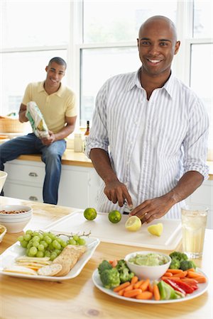 dip and african american - Men making snacks for guests Stock Photo - Premium Royalty-Free, Code: 600-01615059