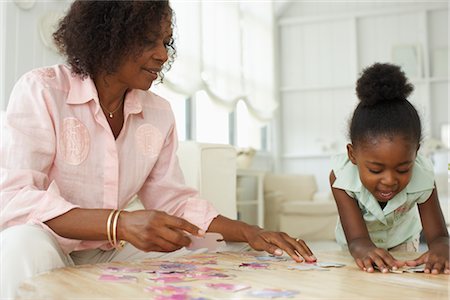 puzzles - Mother and daughter playing games Stock Photo - Premium Royalty-Free, Code: 600-01615052