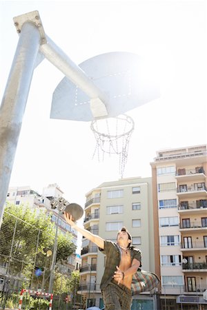 Teenager Playing Basketball Stock Photo - Premium Royalty-Free, Code: 600-01616465