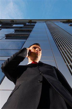 Businessman Using Cell Phone Stock Photo - Premium Royalty-Free, Code: 600-01616524