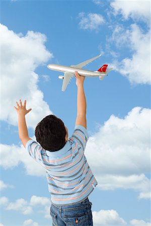 simsearch:400-07474903,k - Boy Playing with Toy Airplane Foto de stock - Sin royalties Premium, Código: 600-01616580