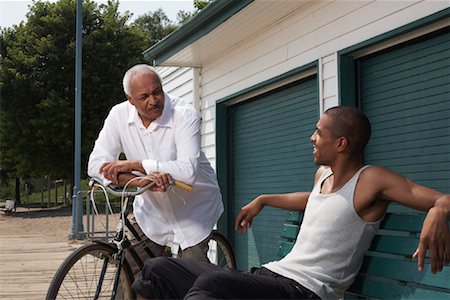 picture of old man on a bike - Men Talking Stock Photo - Premium Royalty-Free, Code: 600-01616623