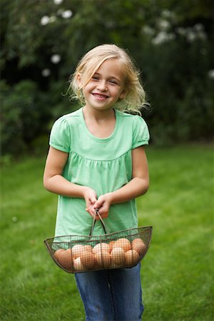 Portrait of Girl Holding Basket of Eggs Stock Photo - Premium Royalty-Free, Code: 600-01616967