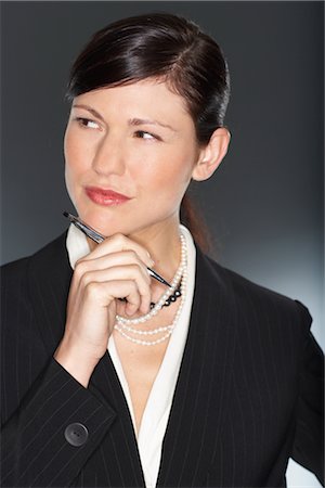 portrait business person close thinking not looking at camera - Portrait of woman Stock Photo - Premium Royalty-Free, Code: 600-01613665