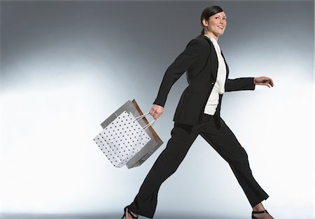 Woman Carrying Shopping Bags Stock Photo - Premium Royalty-Free, Code: 600-01613675