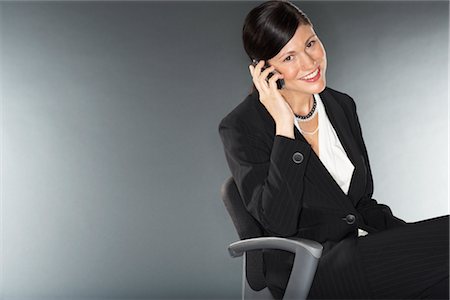 simsearch:700-02080505,k - Businesswoman Talking on Cell Phone Stock Photo - Premium Royalty-Free, Code: 600-01613689