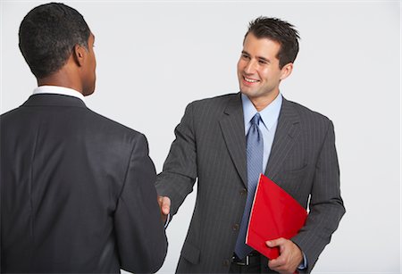 suit man standing backside - Businessmen Shaking Hands Foto de stock - Sin royalties Premium, Código: 600-01613717