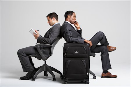 person with old mobile phone - Businessmen Sitting Back to Back in Office Chairs Stock Photo - Premium Royalty-Free, Code: 600-01613721