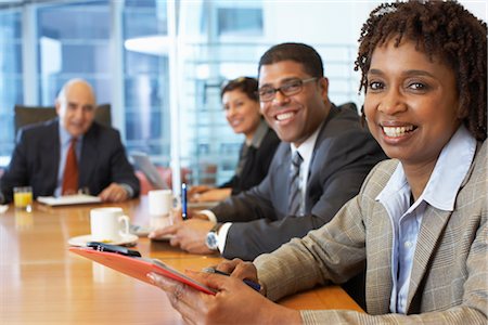 executive looking at camera on desk - Portrait of Business People Stock Photo - Premium Royalty-Free, Code: 600-01613779