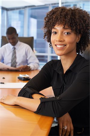 executive looking at camera on desk - Portrait of Businesswoman Stock Photo - Premium Royalty-Free, Code: 600-01613798