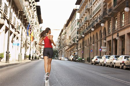 simsearch:600-01172446,k - Woman Jogging on Street Foto de stock - Royalty Free Premium, Número: 600-01630585