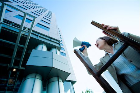 reaching the top - Businesswoman Standing on Ladder using Bullhorn Stock Photo - Premium Royalty-Free, Code: 600-01633268