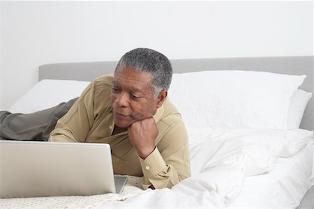 Old black man with a laptop Stock Photos - Page 1 : Masterfile