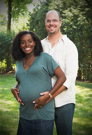 pregnant black women white man - Portrait of Pregnant Couple Stock Photo - Premium Royalty-Free, Code: 600-01644687