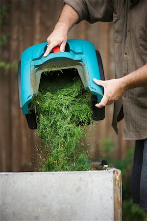 simsearch:600-01644909,k - Man Emptying Grass Clippings Stock Photo - Premium Royalty-Free, Code: 600-01644877