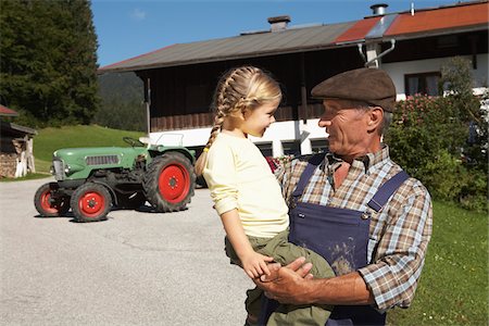 pigtails overalls - Farmer Holding Girl Stock Photo - Premium Royalty-Free, Code: 600-01644967