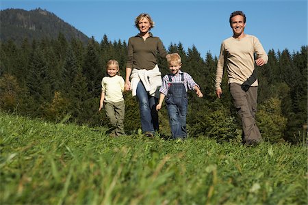 evergreen tree looking up - Family Walking Outdoors Stock Photo - Premium Royalty-Free, Code: 600-01644974