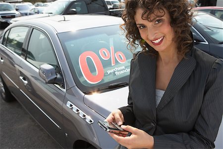 Portrait of Woman in Car Lot Stock Photo - Premium Royalty-Free, Code: 600-01645880