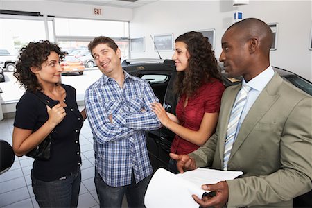 Teenager and Family Shopping For New Car Stock Photo - Premium Royalty-Free, Code: 600-01645930